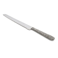 Marked by incredible handcrafting, this bread knife features countless molten beads carefully placed by a highly skilled artisan. The look is streamlined, timeless, organic and soulful.