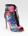 Channel street-chic vibes wearing this satin ankle boot freshened with a lush floral print and suede laces. Self-covered heel, 4½ (115mm)Satin upper with suede lacesAdjustable ankle strapLeather lining and solePadded insoleImported