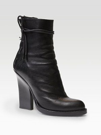 An exaggerated stacked heel heightens this ostrich-print leather ankle boot, with intricately laced trim. Stacked heel, 2¼ (60mm)Stacked platform, ½ (15mm)Compares to a 1¾ heel (45mm)Ostrich-embossed leather upperBack zipLeather lining and solePadded insoleMade in Italy An exaggerated stacked heel heightens this ostrich-print leather ankle boot, with intricately laced trim. Stacked heel, 2¼ (60mm)Stacked platform, ½ (15mm)Compares to a 1¾ heel (45mm)Ostrich-embossed leather upperBack zipLeather lining and solePadded insoleMade in Italy