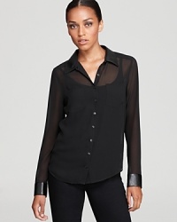 Sheer perfection for fall, this GUESS top flaunts luxe textured cuffs for an elegant element of surprise. Sheer perfection for fall, this GUESS top flaunts luxe textured cuffs for an elegant element of surprise.