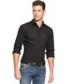 Dress shirt? Sport shirt? This darkly handsome button-front shirt from Armani Jeans crosses the usual categories-and creates a few of its own.