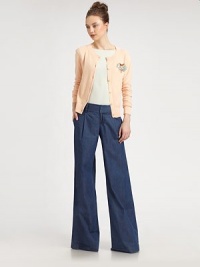 The classic crewneck button-down in a featherweight cotton knit styled with a removable rhinestone brooch.CrewneckLong sleevesButton frontRibbed trimAbout 22 from shoulder to hemCottonDry cleanImportedModel shown is 5'10 (177cm) wearing US size Small The classic crewneck button-down in a featherweight cotton knit styled with a removable rhinestone brooch.CrewneckLong sleevesButton frontRibbed trimAbout 22 from shoulder to hemCottonDry cleanImportedModel shown is 5'10 (177cm) wearing US size Small