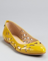 Geometric cut-outs add artful flair to Calvin Klein's Emilia flats, constructed in patent leather that adds polish to every look. Geometric cut-outs add artful flair to Calvin Klein's Emilia flats, constructed in patent leather that adds polish to every look.
