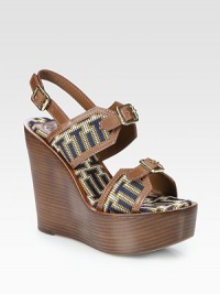 Woven with mod graphics, this '70s-inspired design has an adjustable slingback, leather trim and a chunky stacked wedge. Stacked heel, 5 (125mm)Stacked platform, 2 (50mm)Compares to a 3 heel (75mm)Leather and polyester-blend upperLeather solePadded insoleImportedOUR FIT MODEL RECOMMENDS ordering one size up as this style runs small. 