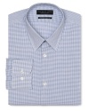 Dress shirt with spread collar, two button barrel cuffs and a contemporary fit through the body, with a blue grid pattern.
