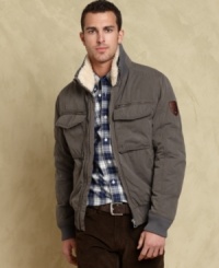 This distressed and rugged bomber jacket from Tommy Hilfiger has your winter style covered. This distressed and rugged bomber jacket from Tommy Hilfiger has your winter style covered.