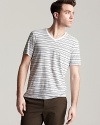 Save the solids for later. This multi-stripe V-neck shirt brings a tone and texture to your everyday warm-weather style.