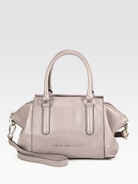 This luxurious leather style features a unique silhouette with a roomy interior.Double top handles, 6 dropDetachable adjustable shoulder strap, 20-21½Top zip closureOne inside zip pocketTwo inside open pocketsFully lined12W X 8½H X 5½DImported This luxurious leather style features a unique silhouette with a roomy interior.Double top handles, 6 dropDetachable adjustable shoulder strap, 20-21½Top zip closureOne inside zip pocketTwo inside open pocketsFully lined12W X 8½H X 5½DImported