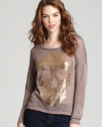 Death becomes her, so to speak, in this Vintage Havana foil skull sweater that playfully takes on this season's shine trend. Death becomes her, so to speak, in this Vintage Havana foil skull sweater that playfully takes on this season's shine trend.