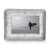 A unique treatment of hand-hammering on top of a cast surface gives this photo frame a unique look. For a beautiful presentation of your most cherished photo.