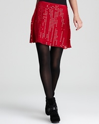 Alight with the dazzling glimmer of sequins, this DKNY skirt steps into the spotlight with a swingy, flared silhouette. Alight with the dazzling glimmer of sequins, this DKNY skirt steps into the spotlight with a swingy, flared silhouette.