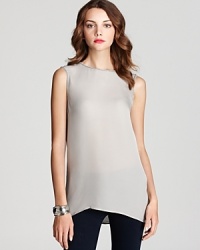 Delicate beaded trim adds a luxe touch to Vince's essential silk shell--a draped keyhole at the back makes a modern exit. Delicate beaded trim adds a luxe touch to Vince's essential silk shell--a draped keyhole at the back makes a modern exit.