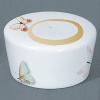 For over two centuries Raynaud has created unique Limoges porcelain, with a marked preference for relief shapes and generously colored and gilt decorations. Metamorphoses is a striking pattern of red and gold with a butterfly motif.