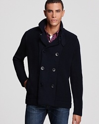 A clever knit wool design employs a classic pea coat silhouette for a unique take on casual cool warmth. A clever knit wool design employs a classic pea coat silhouette for a unique take on casual cool warmth.