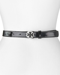 Tory Burch cinches statement style with this patent leather belt. Slim and slick, it's a simple way to work the label's polished, uptown look. Tory Burch cinches statement style with this patent leather belt. Slim and slick, it's a simple way to work the label's polished, uptown look.