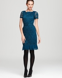 Demure yet dramatic, a timeless Tory Burch dress features a delicate lace overlay and ruffled hemline for an effortless romantic vision. Demure yet dramatic, a timeless Tory Burch dress features a delicate lace overlay and ruffled hemline for an effortless romantic vision.
