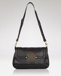 Tory Burch's leather messenger bag is the crossbody on every label lover's list. On weekends, this bag slips over a bold coat to lend a practical dose of chic. Tory Burch's leather messenger bag is the crossbody on every label lover's list. On weekends, this bag slips over a bold coat to lend a practical dose of chic.