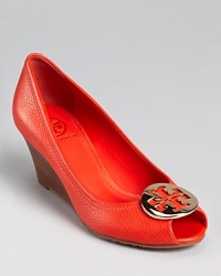 Hot-to-trot: Tory Burch's Sally wedges are the perfect hybrid of your favorite flats, wedges and peep toes in one, finished off with signature logo details. Hot-to-trot: Tory Burch's Sally wedges are the perfect hybrid of your favorite flats, wedges and peep toes in one, finished off with signature logo details.