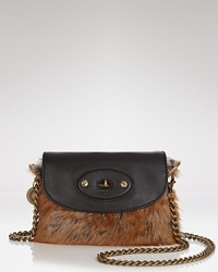 Lamb fur trims are a lush touch on this UGG® Australia shoulder bag, trimmed in leather and sized for day-to-night accessorizing. Lamb fur trims are a lush touch on this UGG® Australia shoulder bag, trimmed in leather and sized for day-to-night accessorizing.