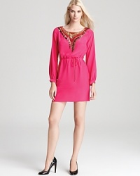 Metallic sequins mix with hot pink on this long-sleeved Trina Turk dress, cinched at the waist for a flattering fit. Metallic sequins mix with hot pink on this long-sleeved Trina Turk dress, cinched at the waist for a flattering fit.