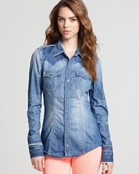 Country gal meets city slicker in this True Religion shirt. Classic denim boasts innovative distressed details for a look that's both casual and cool. Country gal meets city slicker in this True Religion shirt. Classic denim boasts innovative distressed details for a look that's both casual and cool.
