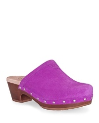 A super comfy and stylish clog from UGG®, the Evie has a soft suede upper, studded sides and wooden sole. A super comfy and stylish clog from UGG®, the Evie has a soft suede upper, studded sides and wooden sole.