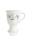 Warm the hearts of your guests with spiced wine or hot cocoa in this beautifully festive Winterberry mug from Pfaltzgraff's holiday collection of dinnerware and dishes. Bright red berries and holly vines accent the sides of this footed mug.