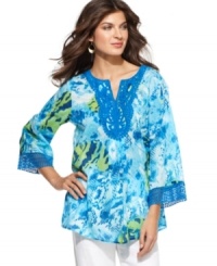 Take a walk on the wild side in Jones New York Signature's tunic, featuring a mixed animal print and embroidered trim at the neckline and cuffs. Take a walk on the wild side in Jones New York Signature's tunic, featuring a mixed animal print and embroidered trim at the neckline and cuffs.
