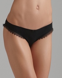 A charming bikini with sheer scalloped edge trim and an intricate lace back. A charming bikini with sheer scalloped edge trim and an intricate lace back.