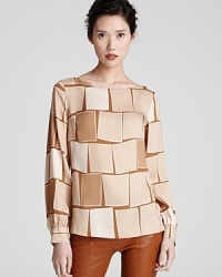 A three-dimensional square print decorates this silk Escada top for eclectic chic. A three-dimensional square print decorates this silk Escada top for eclectic chic.