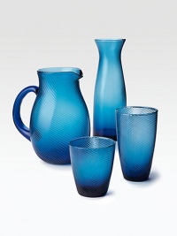 A mouthblown glass pitcher weds modern design with classic style thanks to a gentle, wrap-around texture. From the Twirl CollectionGlass8½H X 7½ diam.Dishwasher safeImported A mouthblown glass pitcher weds modern design with classic style thanks to a gentle, wrap-around texture. From the Twirl CollectionGlass8½H X 7½ diam.Dishwasher safeImported