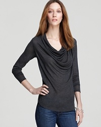 A dramatic cowlneck cascades the length of this Three Dots top, while a sheer finish infuses the style with provocative edge. Contrast the slinky silhouette with a structured leather jacket for tough femininity. A dramatic cowlneck cascades the length of this Three Dots top, while a sheer finish infuses the style with provocative edge. Contrast the slinky silhouette with a structured leather jacket for tough femininity.