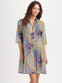 A vibrant geo-tribal print makes this trapeze dress a must-have. Mandarin collarElbow-length sleevesButton placketPull-on style70% cotton/30% silkDry cleanMade in Italy