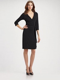 A true classic, this shape-flattering wrap has three-quarter cuffed sleeves. V neckline Self tie at waist About 25 from natural waist 85% viscose/15% polyester Dry clean Made in USAOUR FIT MODEL RECOMMENDS ordering true size. A true classic, this shape-flattering wrap has three-quarter cuffed sleeves. V neckline Self tie at waist About 25 from natural waist 85% viscose/15% polyester Dry clean Made in USAOUR FIT MODEL RECOMMENDS ordering true size.