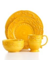 Raised florals in the style of Fitz and Floyd's Ricamo dinnerware come across even bolder in sunny gold place settings. Pair with multicolored pieces to put your own spin on casual country dining.