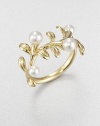 A floral piece in 18k gold and lustrous cultured pearls. 3.75mm-4.75mm round white cultured pearls18k goldImported 