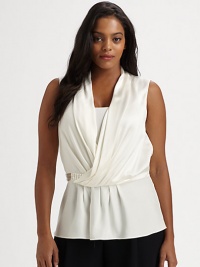 Inspired by a universally flattering Grecian style, a sleeveless silk top with a sparkling embellished waist detail. Gathered crossover frontSleevelessSide zipperEmbellishment at waistGrosgrain detail at back of waistAbout 27 from shoulder to hemSilkDry cleanImported Inspired by a universally flattering Grecian style, a sleeveless silk top with a sparkling embellished waist detail. Gathered crossover frontSleevelessSide zipperEmbellishment at waistGrosgrain detail at back of waistAbout 27 from shoulder to hemSilkDry cleanImported