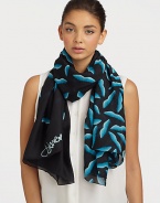 A smooth silk style that features a graphic, abstract lip print. SilkAbout 40 X 67Dry cleanImported 