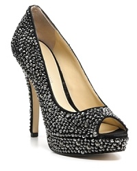 Encrusted in shimmering crystals, these dazzling pumps make a statement under spotlights and disco balls alike. From Enzo Angiolini.