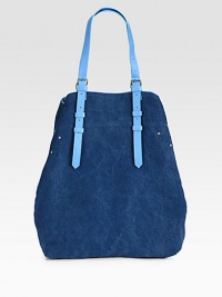 A casually chic style in denim-inspired canvas with luxurious leather trim.Adjustable shoulder straps, 2-14 dropSnap button strap closureOne inside open pocketOne detachable flashlight12W X 15H X 4DMade in Italy A casually chic style in denim-inspired canvas with luxurious leather trim.Adjustable shoulder straps, 2-14 dropSnap button strap closureOne inside open pocketOne detachable flashlight12W X 15H X 4DMade in Italy