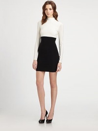 This bold, panel-constructed piece is cut with a flattering, form-fitting silhouette.Mock turtleneckLong sleevesAbout 18 from natural waist95% polyester/5% spandexDry cleanMade in USA of imported fabricModel shown is 5'10 (177cm) wearing US size Small. This bold, panel-constructed piece is cut with a flattering, form-fitting silhouette.Mock turtleneckLong sleevesAbout 18 from natural waist95% polyester/5% spandexDry cleanMade in USA of imported fabricModel shown is 5'10 (177cm) wearing US size Small.