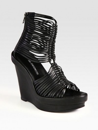 Amped up by a self-covered wedge and platform, skinny leather straps burst from this classic gladiator silhouette. Self-covered wedge, 5 (125mm)Stacked platform, 1½ (40mm)Compares to a 3½ heel (90mm)Leather upperBack zipperLeather lining and solePadded insoleMade in ItalyOUR FIT MODEL RECOMMENDS ordering true size. Amped up by a self-covered wedge and platform, skinny leather straps burst from this classic gladiator silhouette. Self-covered wedge, 5 (125mm)Stacked platform, 1½ (40mm)Compares to a 3½ heel (90mm)Leather upperBack zipperLeather lining and solePadded insoleMade in ItalyOUR FIT MODEL RECOMMENDS ordering true size.