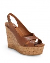 THE LOOKCrisscross leather upperAdjustable slingback strapPadded insoleCork wedge, 5 (125mm)Cork platform, 1½ (40mm)Compares to a 3½ heel (90mm)THE MATERIALLeather upperLeather liningRubber soleORIGINImported