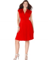 A banded empire waist lends a sleeker silhouette to the cap sleeve plus size dress by Soprano, featuring a pleated skirt. A banded empire waist lends a sleeker silhouette to the cap sleeve plus size dress by Soprano, featuring a pleated skirt.