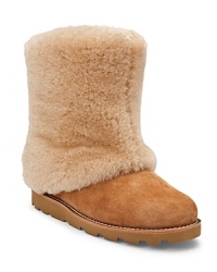 These fuzzy boots show off UGG® Australia's cozy-cool shearling style. These fuzzy boots show off UGG® Australia's cozy-cool shearling style.