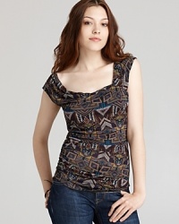 An eclectic print brings worldly flair to this Velvet by Graham & Spencer top. An eclectic print brings worldly flair to this Velvet by Graham & Spencer top.