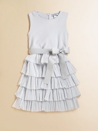 A party-perfect, sleeveless frock is frilly and fun with a ruffled metallic skirt and sash tie waistband.Round necklineSleevelessBack zipperWaistband with sash tieRuffled skirtBodice: CottonSkirt: 52% metallic polyester/48% nylonDry cleanImported