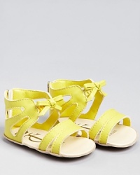 We love the light look of these cute cut-out sandals, adorned at the ankle with an elastic bow. We love the light look of these cute cut-out sandals, adorned at the ankle with an elastic bow.