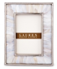 Enhance the look of any photo when framed in the beauty of Mother of Pearl. A slim line of metal surrounds this natural composition with the classic style of Lauren Ralph Lauren. Enhance the look of any photo when framed in the beauty of Mother of Pearl. A slim line of metal surrounds this natural composition with the classic style of Lauren Ralph Lauren.