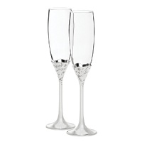 The Vera Lace Bouquet champagne flutes feature a delicate raised floral motif that evoke Vera Wang's well-known love of flowers. Designed with the bride in mind, this feminine yet contemporary set of 2 glasses is a keepsake-worthy gift she'll cherish. The Vera Lace Bouquet champagne flutes feature a delicate raised floral motif that evoke Vera Wang's well-known love of flowers. Designed with the bride in mind, this feminine yet contemporary set of 2 glasses is a keepsake-worthy gift she'll cherish.